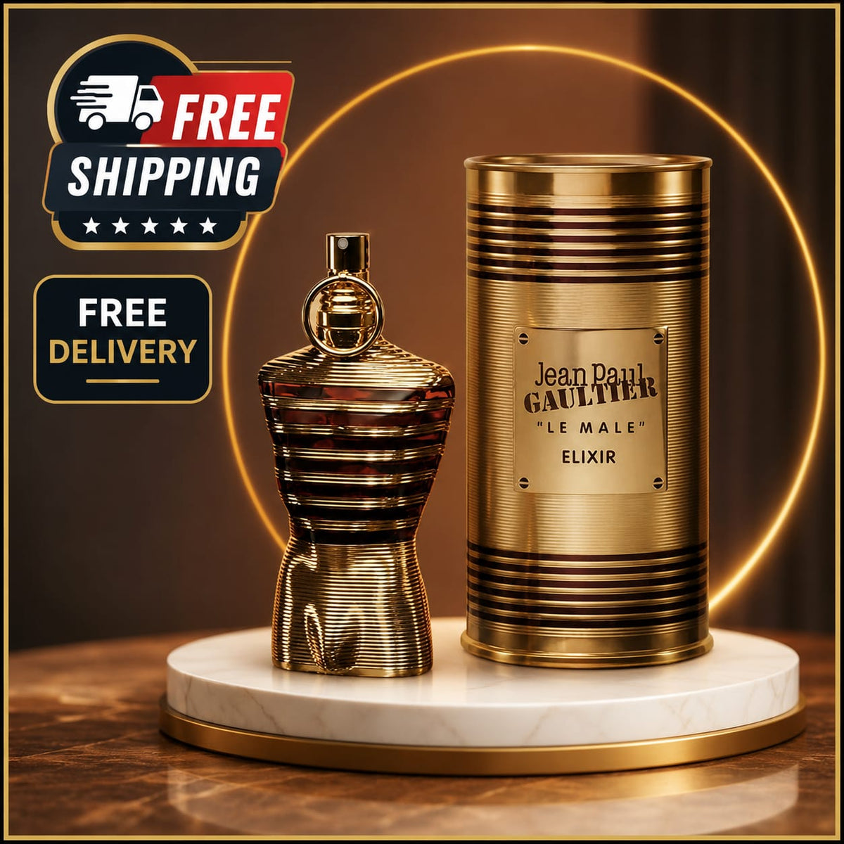 Jean Paul Gaultier 'Le Male' Elixir perfume bottle and its cylindrical packaging box, both in a metallic gold finish, displayed on a white marble pedestal with a gold ring light in the background. Prominent 'FREE SHIPPING' and 'FREE DELIVERY' graphic overlays are visible in the top left corner.