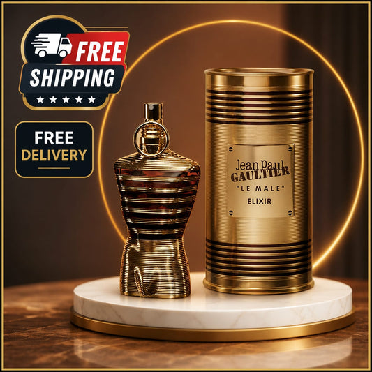 Jean Paul Gaultier 'Le Male' Elixir perfume bottle and its cylindrical packaging box, both in a metallic gold finish, displayed on a white marble pedestal with a gold ring light in the background. Prominent 'FREE SHIPPING' and 'FREE DELIVERY' graphic overlays are visible in the top left corner.